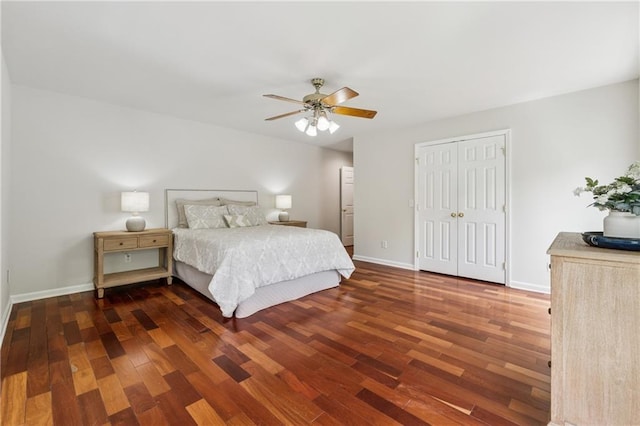 bedroom featuring a closet, baseboards, a ceiling fan, and wood finished floors