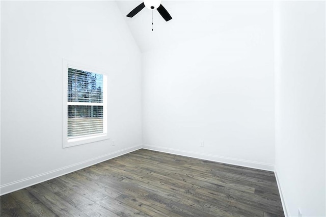 empty room with dark wood-style floors, a ceiling fan, baseboards, and high vaulted ceiling