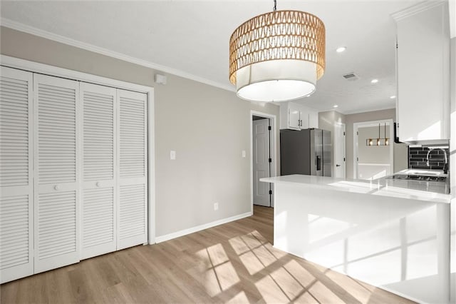 kitchen featuring light wood finished floors, visible vents, white cabinetry, and stainless steel fridge with ice dispenser