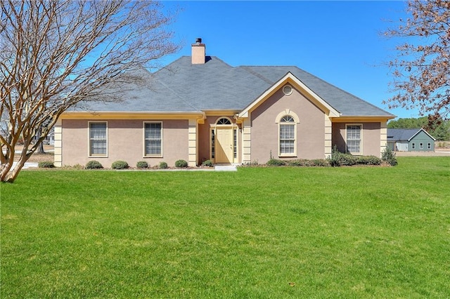 ranch-style home featuring a front lawn, a chimney, and stucco siding