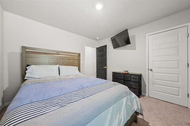 bedroom featuring light colored carpet