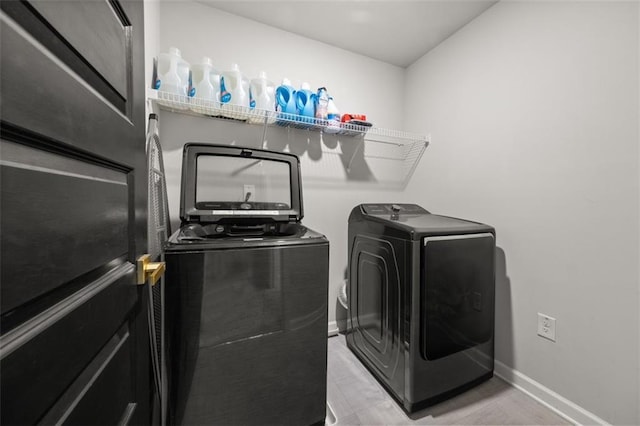 laundry area featuring independent washer and dryer