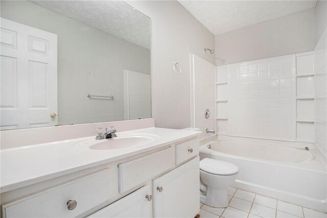 full bathroom with tile patterned floors, toilet, shower / bath combination, vanity, and a textured ceiling