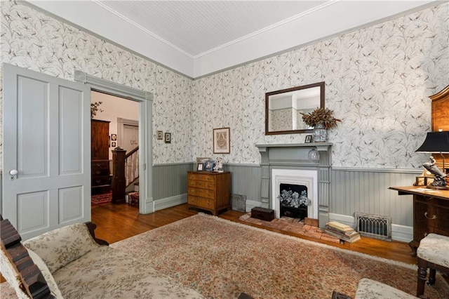 sitting room featuring dark hardwood / wood-style flooring and crown molding