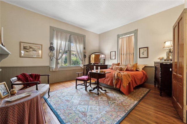 bedroom with hardwood / wood-style flooring