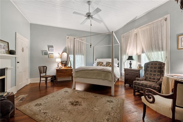 bedroom with ceiling fan and dark hardwood / wood-style floors