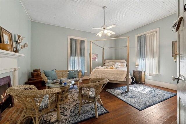 bedroom featuring ceiling fan and dark hardwood / wood-style flooring