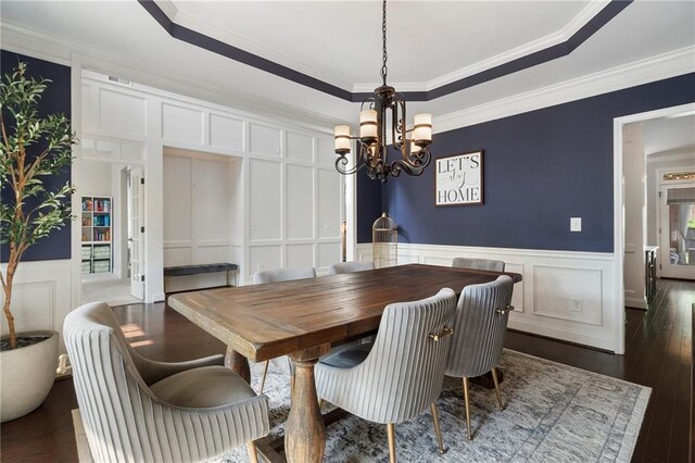 416 Battlefield Creek Dr, Marietta, GA 30064 - dining area featuring a decorative wall, a chandelier, ornamental molding, dark wood-type flooring, and wainscoting
