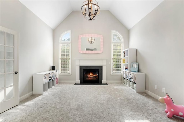 416 Battlefield Creek Dr, Marietta, GA 30064 - living area with a chandelier, a fireplace with flush hearth, carpet flooring, and vaulted ceiling