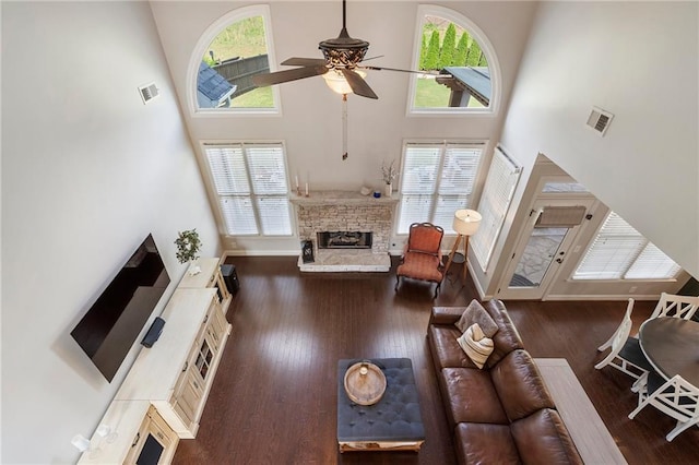 416 Battlefield Creek Dr, Marietta, GA 30064 - living area with a towering ceiling, a stone fireplace, plenty of natural light, ceiling fan, and wood finished floors