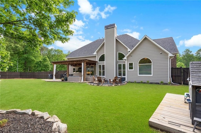 416 Battlefield Creek Dr, Marietta, GA 30064 - back of property with a fenced backyard, roof with shingles, a chimney, a deck, and a patio area