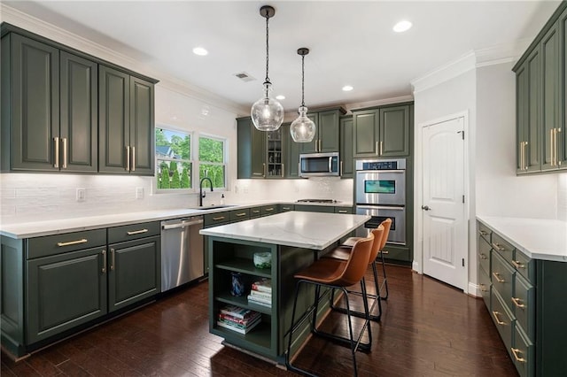 416 Battlefield Creek Dr, Marietta, GA 30064 - kitchen featuring appliances with stainless steel finishes, crown molding, a center island, a kitchen bar, and decorative backsplash