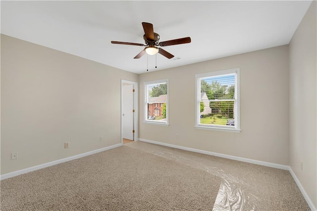 1368 Poplar Pointe SE, Smyrna, GA 30082 - spare room with light colored carpet, baseboards, and ceiling fan