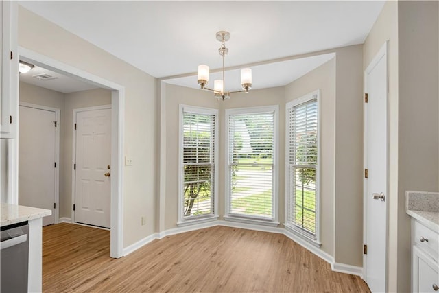1368 Poplar Pointe SE, Smyrna, GA 30082 - unfurnished dining area featuring light wood-type flooring, baseboards, plenty of natural light, and a chandelier