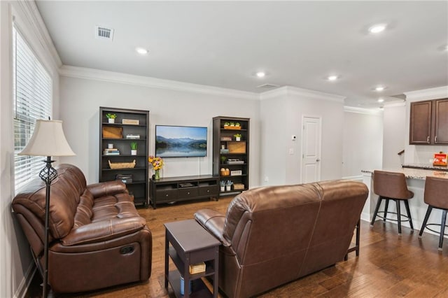 living room with crown molding and dark hardwood / wood-style floors