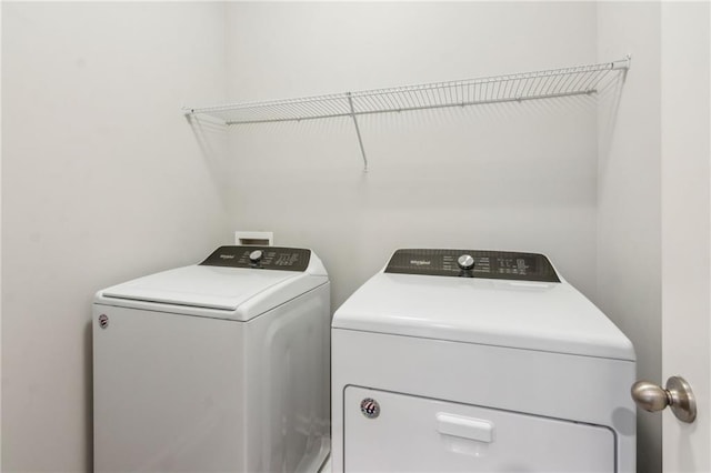 laundry room with separate washer and dryer