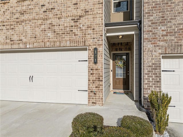 doorway to property featuring a garage