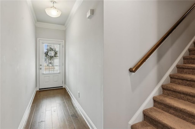 doorway to outside featuring wood-type flooring and crown molding