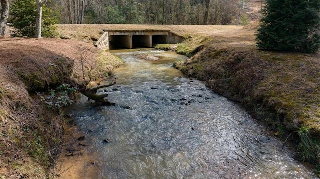 exterior space featuring a forest view