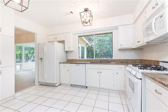 2753 Fireside Ct SE, Marietta, GA 30067 - kitchen featuring white appliances, a sink, white cabinetry, and dark stone counters
