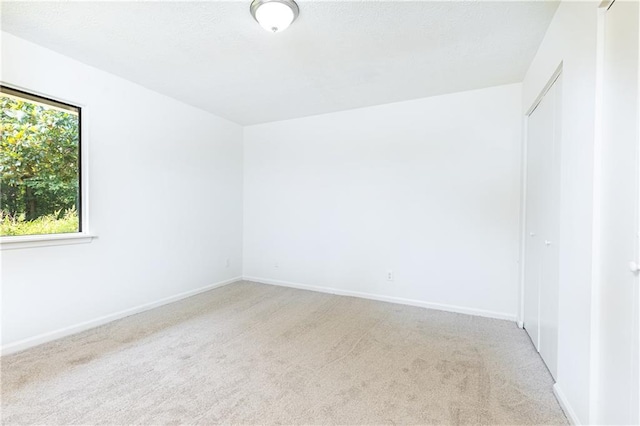 2753 Fireside Ct SE, Marietta, GA 30067 - spare room featuring light colored carpet and baseboards