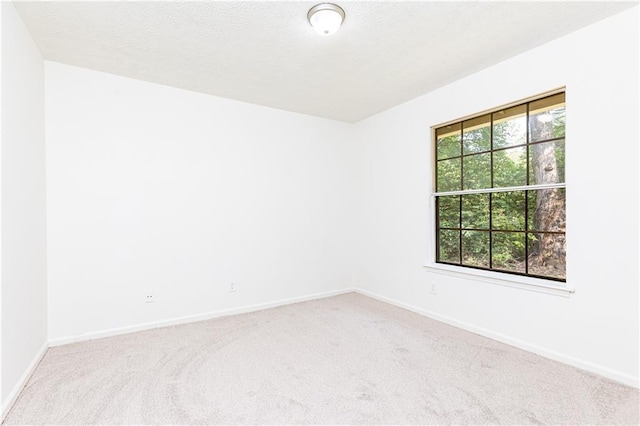 2753 Fireside Ct SE, Marietta, GA 30067 - carpeted empty room with baseboards and a textured ceiling