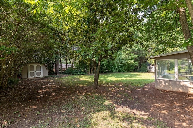2753 Fireside Ct SE, Marietta, GA 30067 - view of green lawn with a sunroom