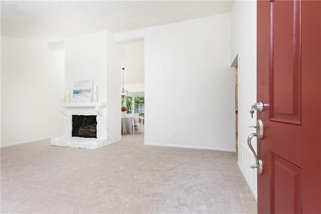 2753 Fireside Ct SE, Marietta, GA 30067 - foyer with carpet flooring, a fireplace, and baseboards