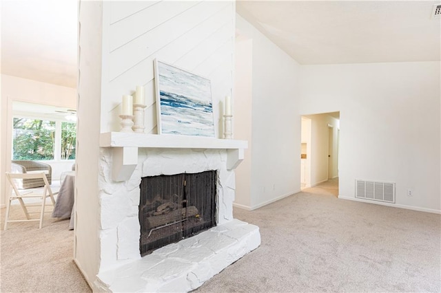 2753 Fireside Ct SE, Marietta, GA 30067 - unfurnished living room featuring carpet flooring, vaulted ceiling, baseboards, and a fireplace with raised hearth
