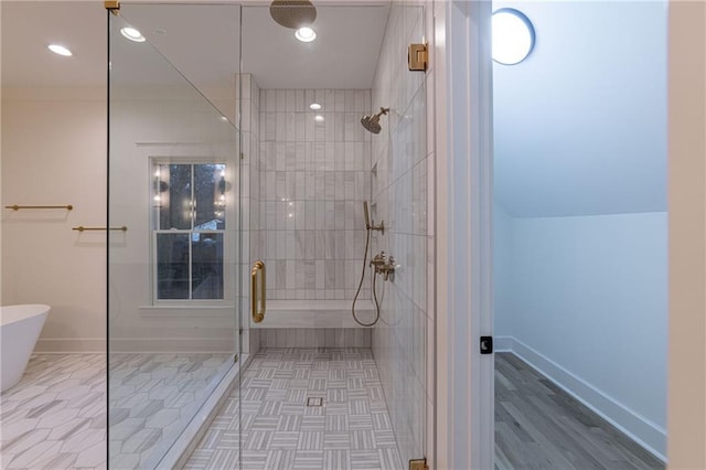 full bathroom with a stall shower, baseboards, and recessed lighting