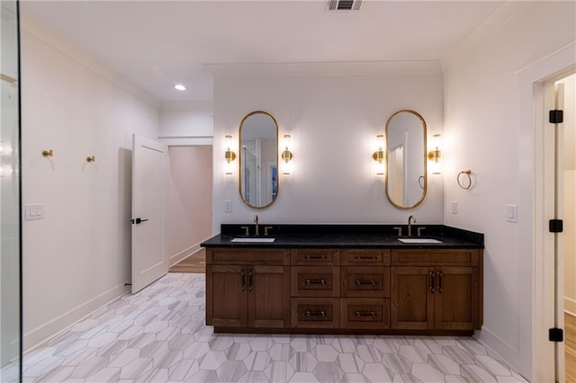 full bath featuring visible vents, a sink, baseboards, and double vanity