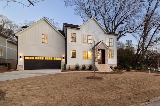 modern farmhouse style home featuring board and batten siding, concrete driveway, and a garage