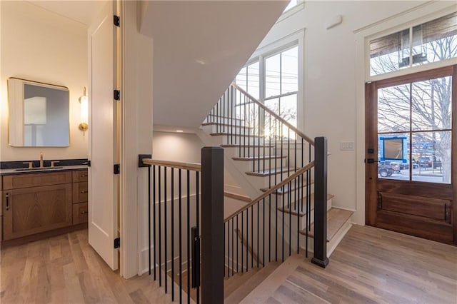 stairs with wood finished floors