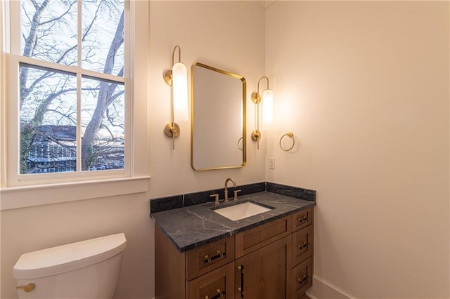 half bath with vanity and toilet