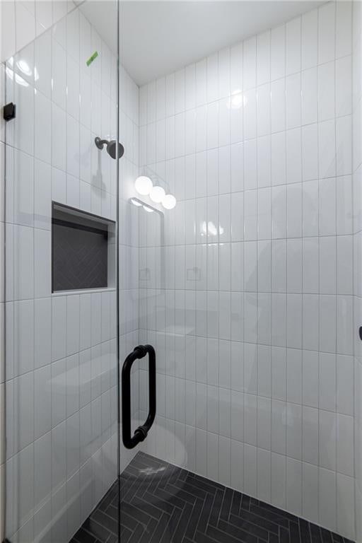 full bathroom featuring a stall shower