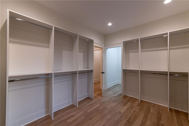 spacious closet with wood finished floors