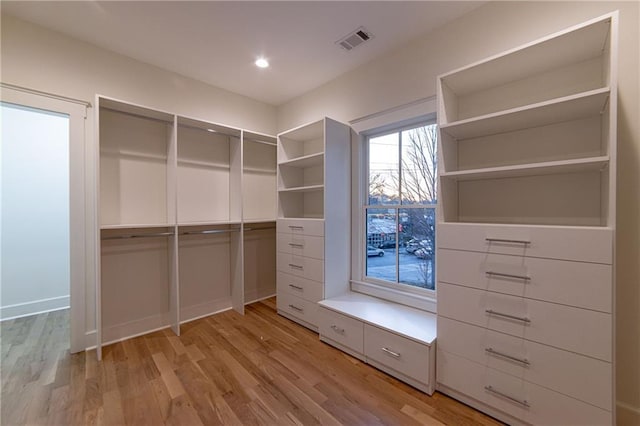 spacious closet featuring light wood finished floors and visible vents