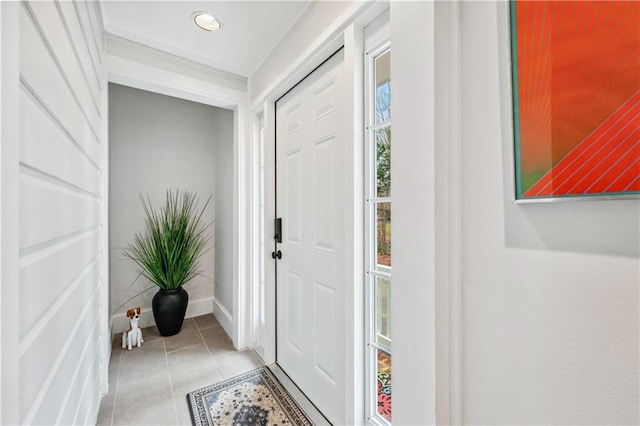 entryway with baseboards, recessed lighting, and light tile patterned flooring