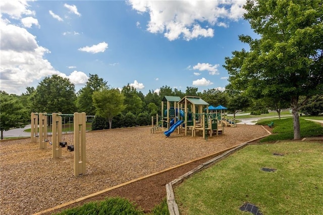 communal playground featuring a yard