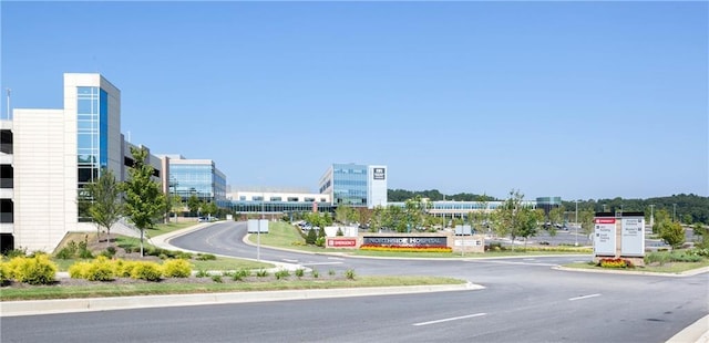 view of street with curbs and a view of city