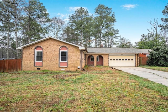 ranch-style home featuring a garage and a front yard