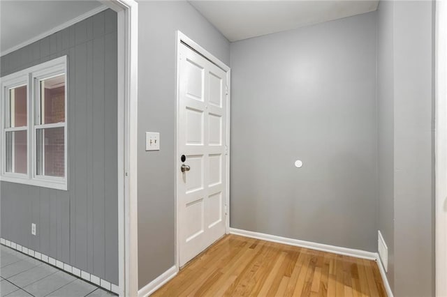 doorway with light wood-type flooring