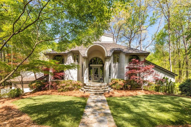 6525 Old Riverside Dr NW, Sandy Springs, GA 30328 - mediterranean / spanish house featuring a front lawn and stucco siding