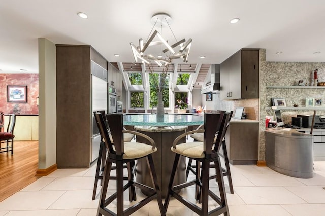6525 Old Riverside Dr NW, Sandy Springs, GA 30328 - dining area featuring light tile patterned floors, recessed lighting, and a notable chandelier