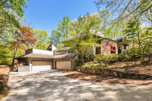 6525 Old Riverside Dr NW, Sandy Springs, GA 30328 - view of front of home featuring stucco siding and concrete driveway