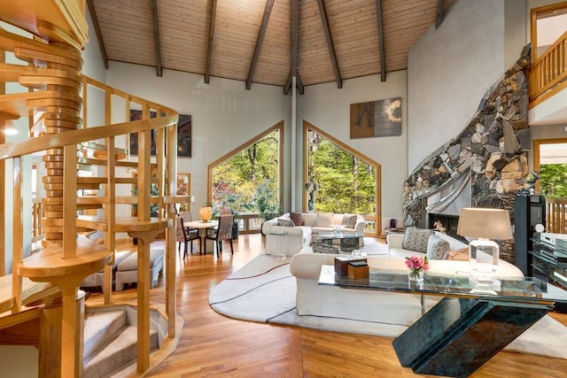 6525 Old Riverside Dr NW, Sandy Springs, GA 30328 - living room with wood finished floors, stairs, wood ceiling, beamed ceiling, and a high ceiling