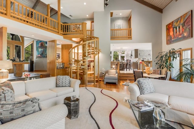 6525 Old Riverside Dr NW, Sandy Springs, GA 30328 - living room featuring wood finished floors, recessed lighting, high vaulted ceiling, and stairs