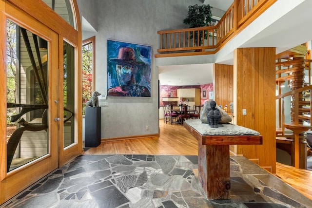 6525 Old Riverside Dr NW, Sandy Springs, GA 30328 - entrance foyer with baseboards, stairway, wood finished floors, and a towering ceiling