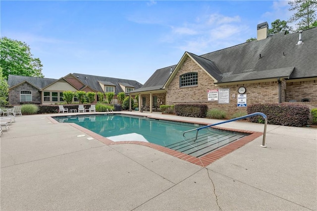 pool featuring a patio area