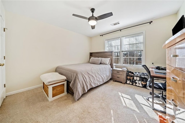 bedroom featuring visible vents, baseboards, a ceiling fan, and carpet flooring